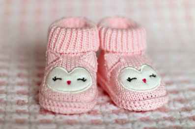 close up of pink baby booties